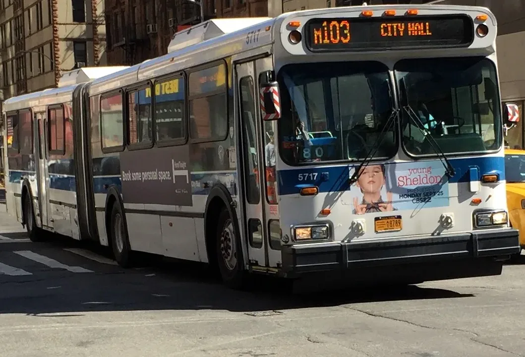 MTA Bus 5717 is headed towards City Hall on the M103 route.