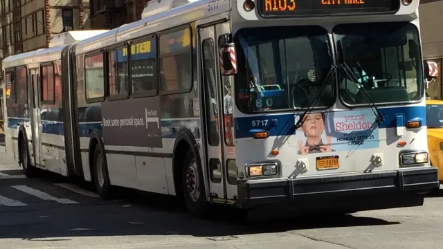 MTA Bus 5717 is headed towards City Hall on the M103 route.