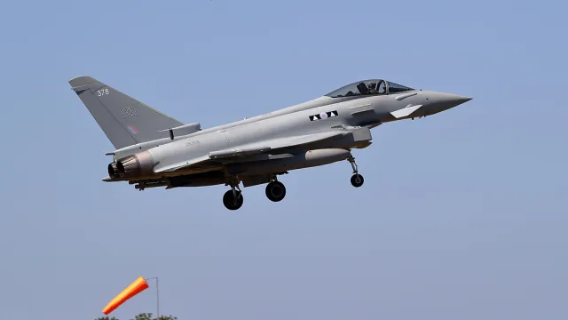 A Typhoon at RAF Lossiemouth. This 2 Squadron Typhoon military jet is on the approach to Runway 05 at the RAF base.
