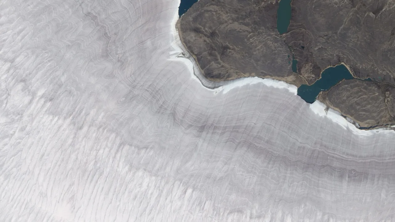 Natural-colour image of the Barnes Ice Cap, a bowling-pin-shaped glacier on Canada’s Baffin Island.