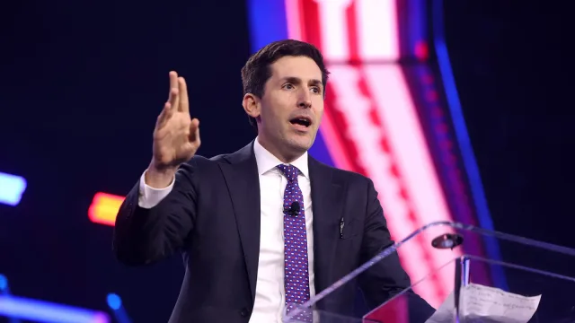 Calley Means speaking with attendees at the 2024 AmericaFest at the Phoenix Convention Center in Phoenix, Arizona.