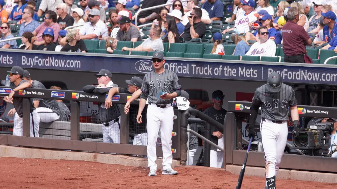 Carlos Mendoza just outside the dugout