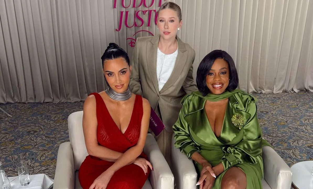 Kim Kardashian, seated left, and her "All's Fair" co-star Niecy Nash, seated right, with Brazilian TV presenter Cela Lopes, standing, at a 2025 promotional event for the series in São Paulo