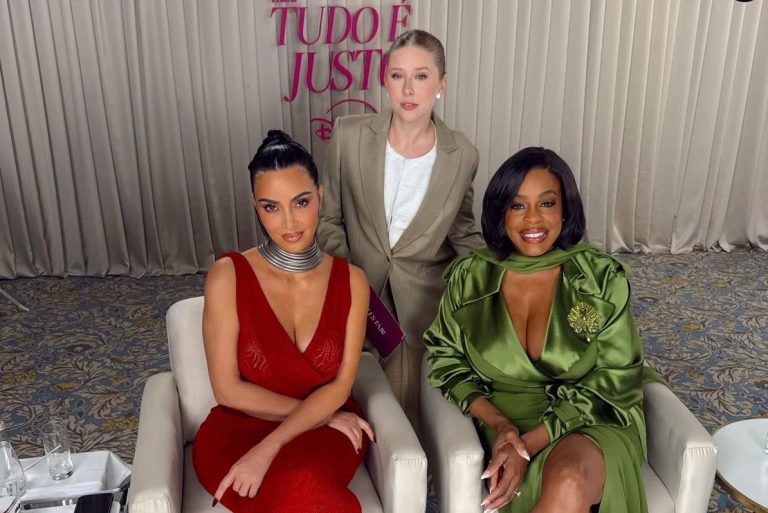 Kim Kardashian, seated left, and her "All's Fair" co-star Niecy Nash, seated right, with Brazilian TV presenter Cela Lopes, standing, at a 2025 promotional event for the series in São Paulo