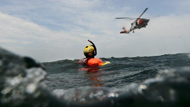 Coast Guard rescue swimmers train with an MH-60 Jayhawk helicopter crew from Air Station Cape Cod, Massachusetts, in 2015.
