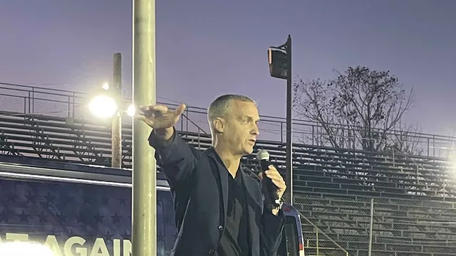 Corey Lewandowski speaks at the Team Trump Bus Tour Rally at Wake County Speedway on October 17, 2024