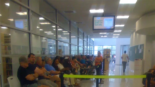 Early voters seated inside the polling place waiting