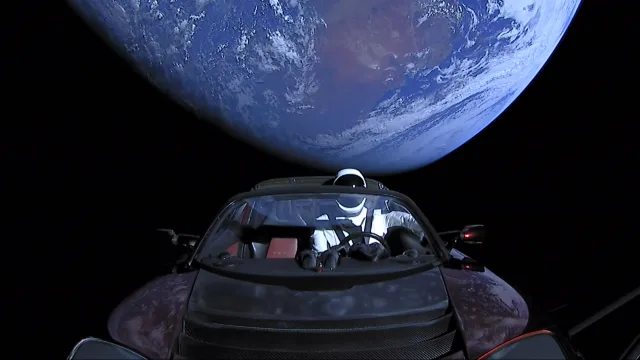 Elon Musk's Tesla Roadster, with Earth in background.