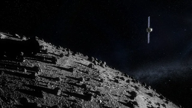 ESA's Hera mission for planetary defence seen approaching the boulder-strewn Dimorphos asteroid.