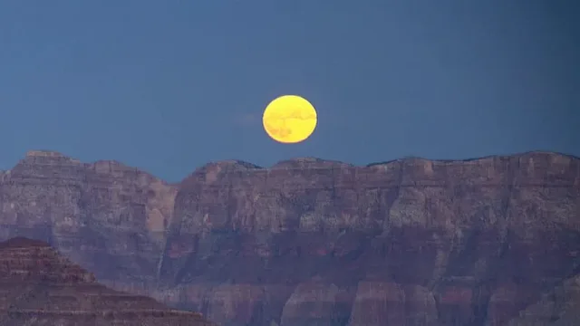 The Full Moon rising over the canyon on the evening of Sunday, October 9, 2022, as seen from Yaki Point on the South Rim.