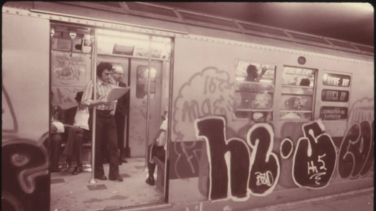 GRAFFITI ON A SUBWAY CAR ON THE LEXINGTON AVENUE LINE IN NEW YORK CITY. IN 1973 TRANSIT AUTHORITY POLICE ARRESTED MORE THAN…