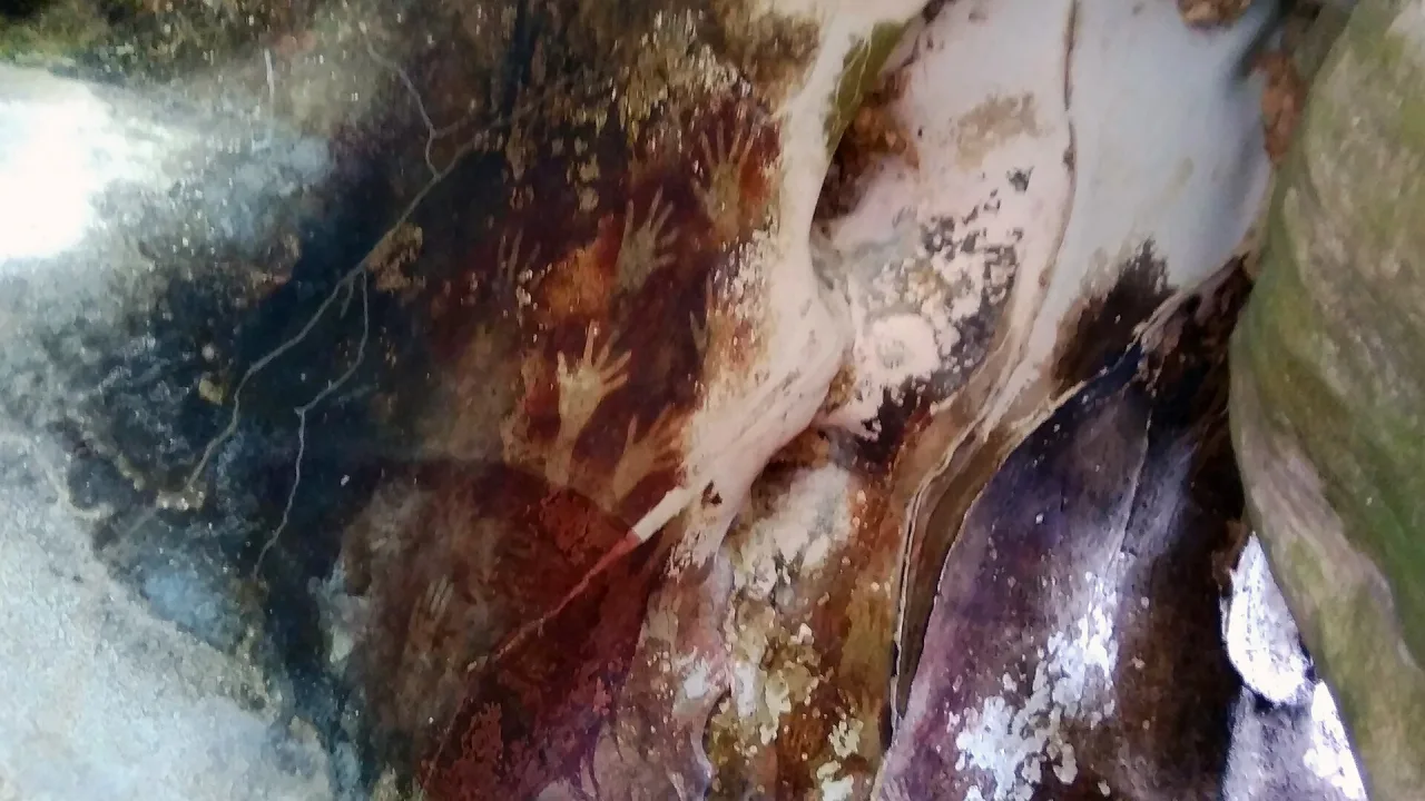 Hand print paintings in Pettakere Cave, Maros