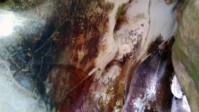 Hand print paintings in Pettakere Cave, Maros