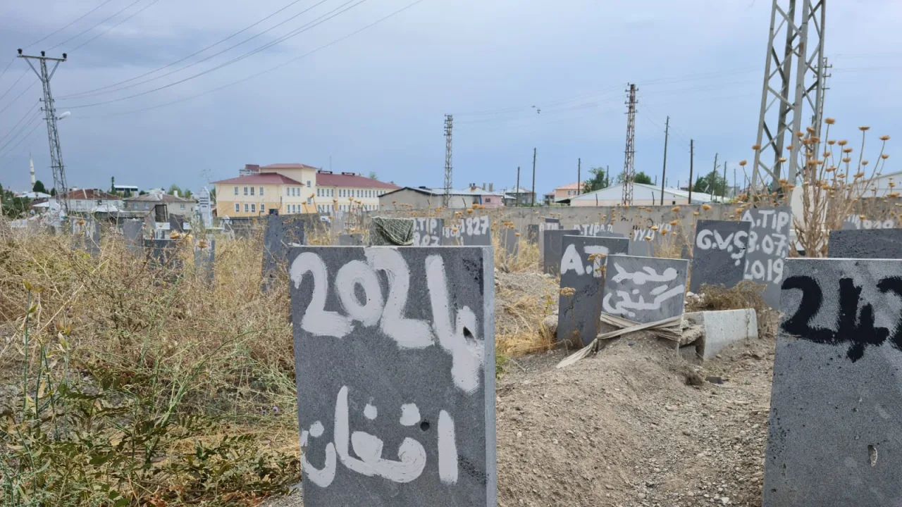 In an area of a graveyard set aside for the bodies of refugees found dead as they attempt to find safety, this grave says si…