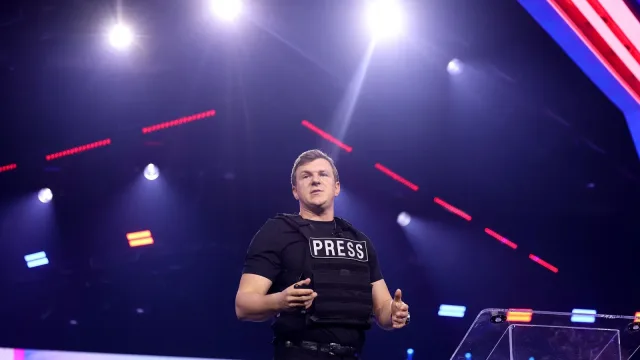 James O'Keefe speaking with attendees at the 2024 AmericaFest at the Phoenix Convention Center in Phoenix, Arizona.
