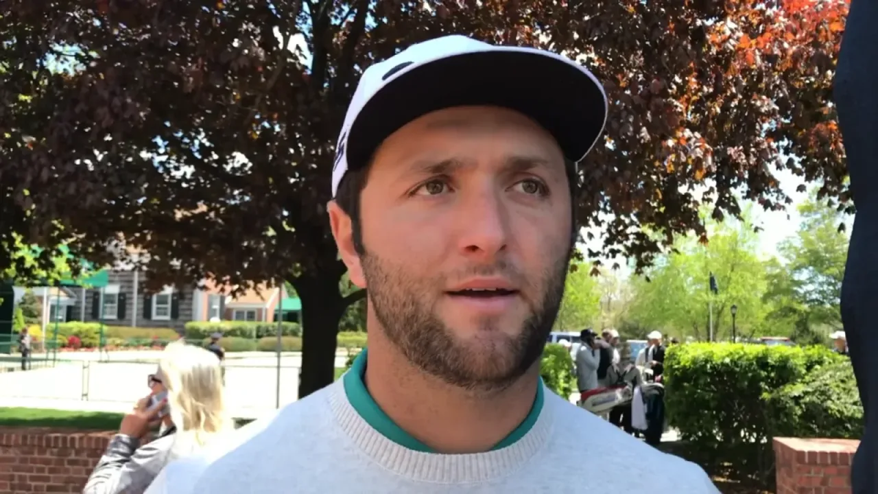 Jon Rahm looking slightly off camara while being interviewed. This screenshot is from approximately 0:23 of the source video.
