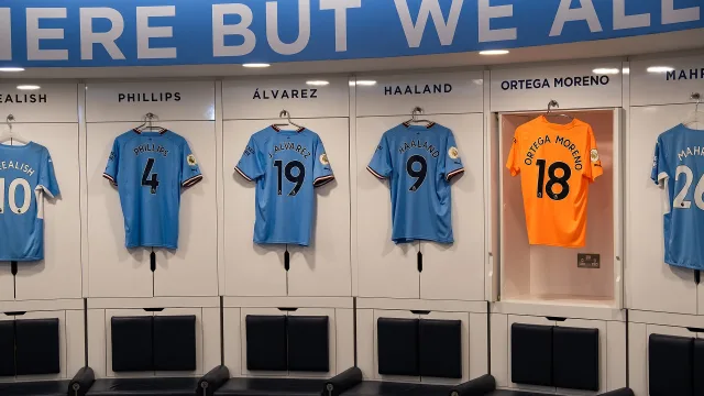 Kalvin Phillips, Julian Alvarez, Erling Haaland and Stefan Ortega kits in the Manchester City dressing room in July 2022.