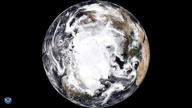 A NOAA-20 satellite composite image of Earth centered on the North Pole, from 2018.