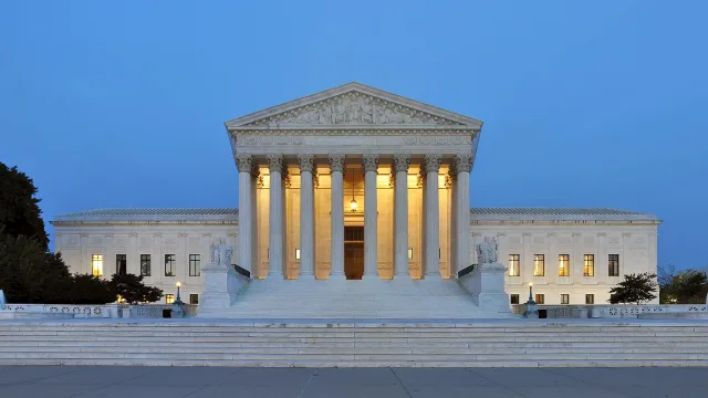 Panorama of the west facade of United States Supreme Court Building at dusk in Washington, D.C., United States of America.