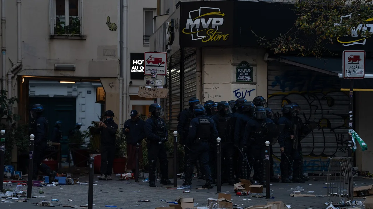 Paris riots, 17 October 2026 - Riot police outside a looted shop - JJxFile