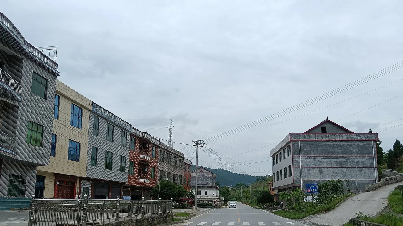 Residential buildings on both sides of a road, in the town of Fukou, Lianyuan, Hunan, China.