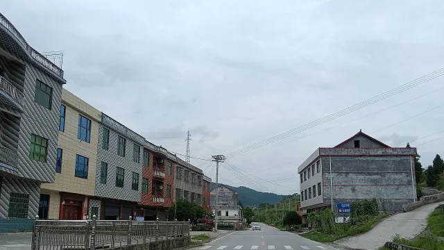 Residential buildings on both sides of a road, in the town of Fukou, Lianyuan, Hunan, China.
