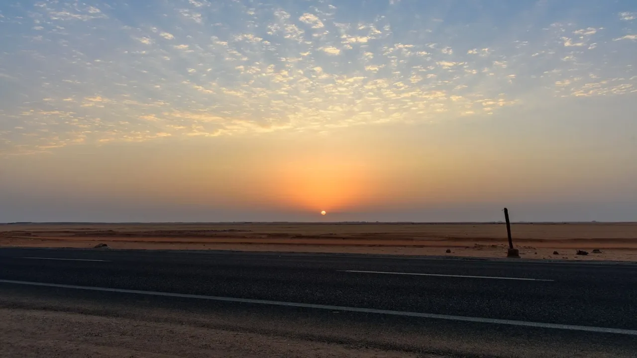 Sunrise over the Sahara on the road to Abu Simbel, Egypt.