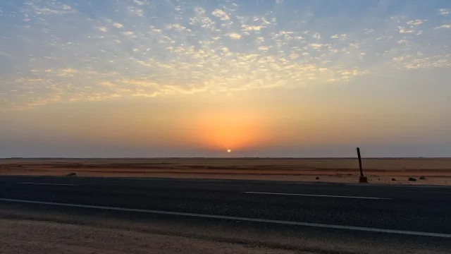 Sunrise over the Sahara on the road to Abu Simbel, Egypt.