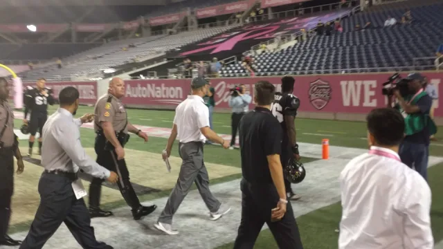UCF Coach Scott Frost leaving the field after the loss