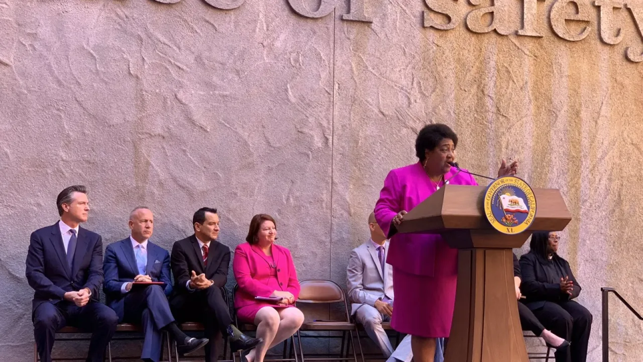 Shirley Weber speaking at the signing of AB392.