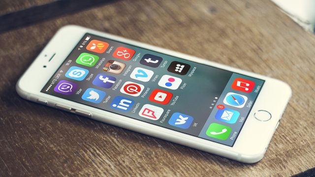 Social media app icons on a smartphone screen