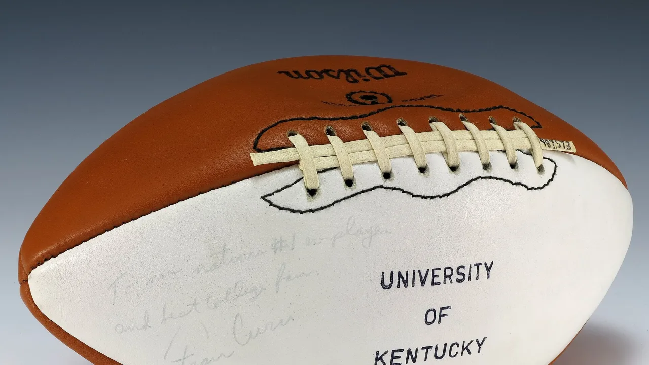 A football signed by the University of Kentucky Wildcats coach, Fran Curci.