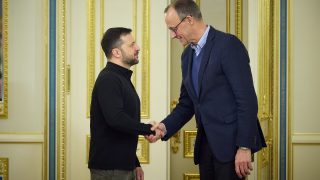 Ukrainian President Volodymyr Zelenskyy shakes hands with Friedrich Merz in Kyiv in December 2024.