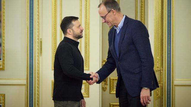 Ukrainian President Volodymyr Zelenskyy shakes hands with Friedrich Merz in Kyiv in December 2024.