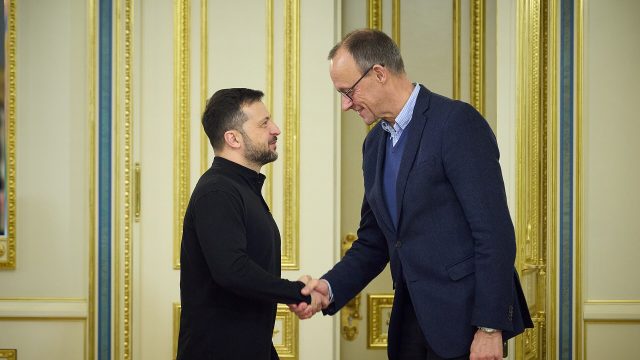 Ukrainian President Volodymyr Zelenskyy shakes hands with Friedrich Merz in Kyiv in December 2024.