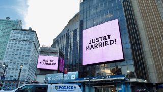 Digital screens outside Madison Square Garden in New York read "JUST&T MARRIED!" on July 3, 2026, the night Taylor Swift and Travis Kelce wed