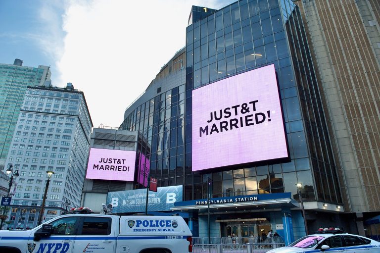 Digital screens outside Madison Square Garden in New York read "JUST&T MARRIED!" on July 3, 2026, the night Taylor Swift and Travis Kelce wed